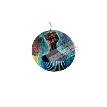 Detailed view of Black Power Fist hair pick earrings showing vibrant multicolored background design and lightweight wooden construction